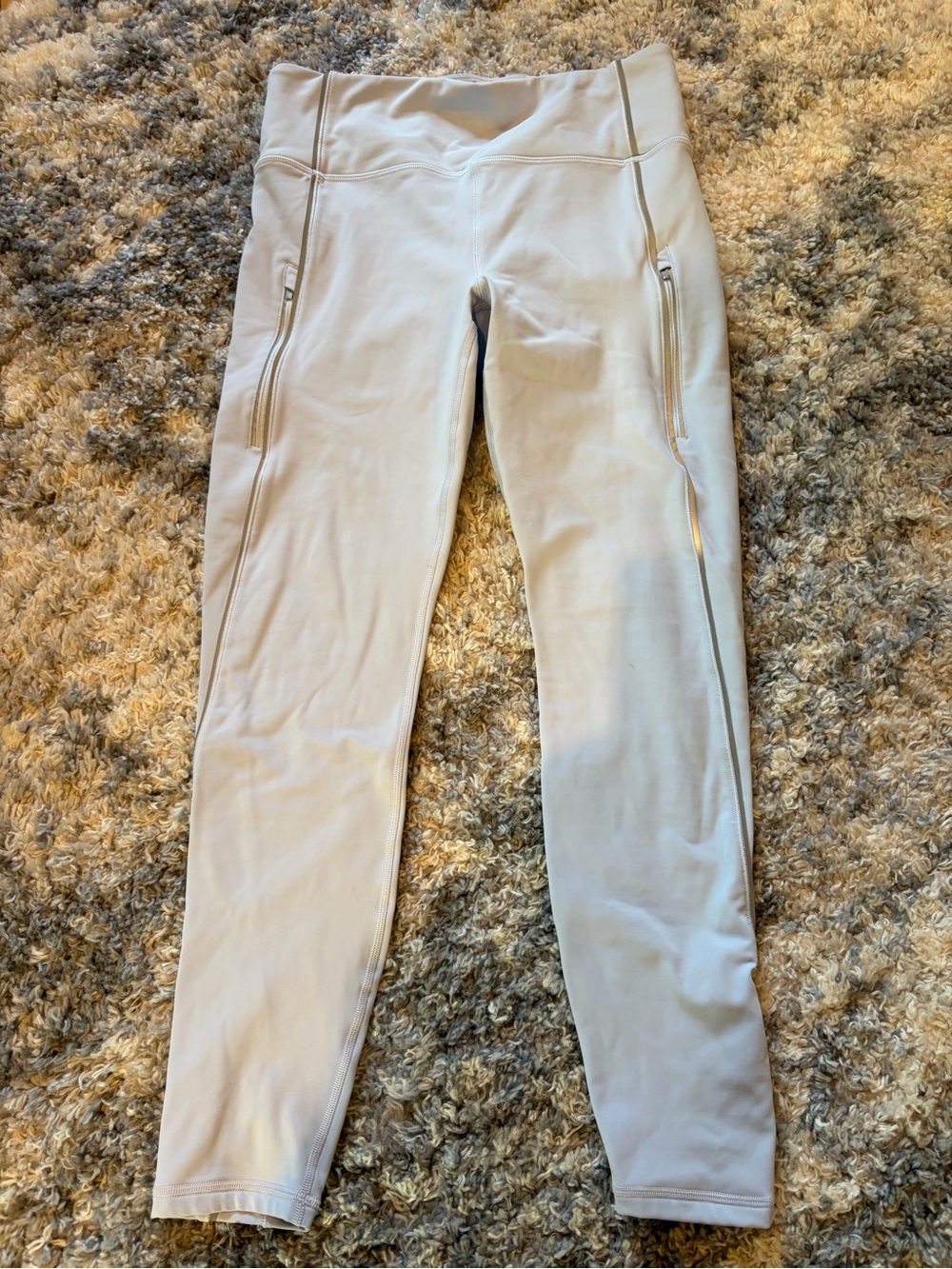 Athleta baby blue Rainer reflective stripe tight with Zip Pockets.
